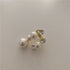 Elegant multi pearl ring for women with rhinestone accents.