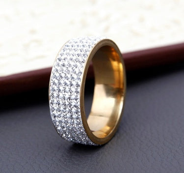 Stainless steel ring with five rows of small stones.