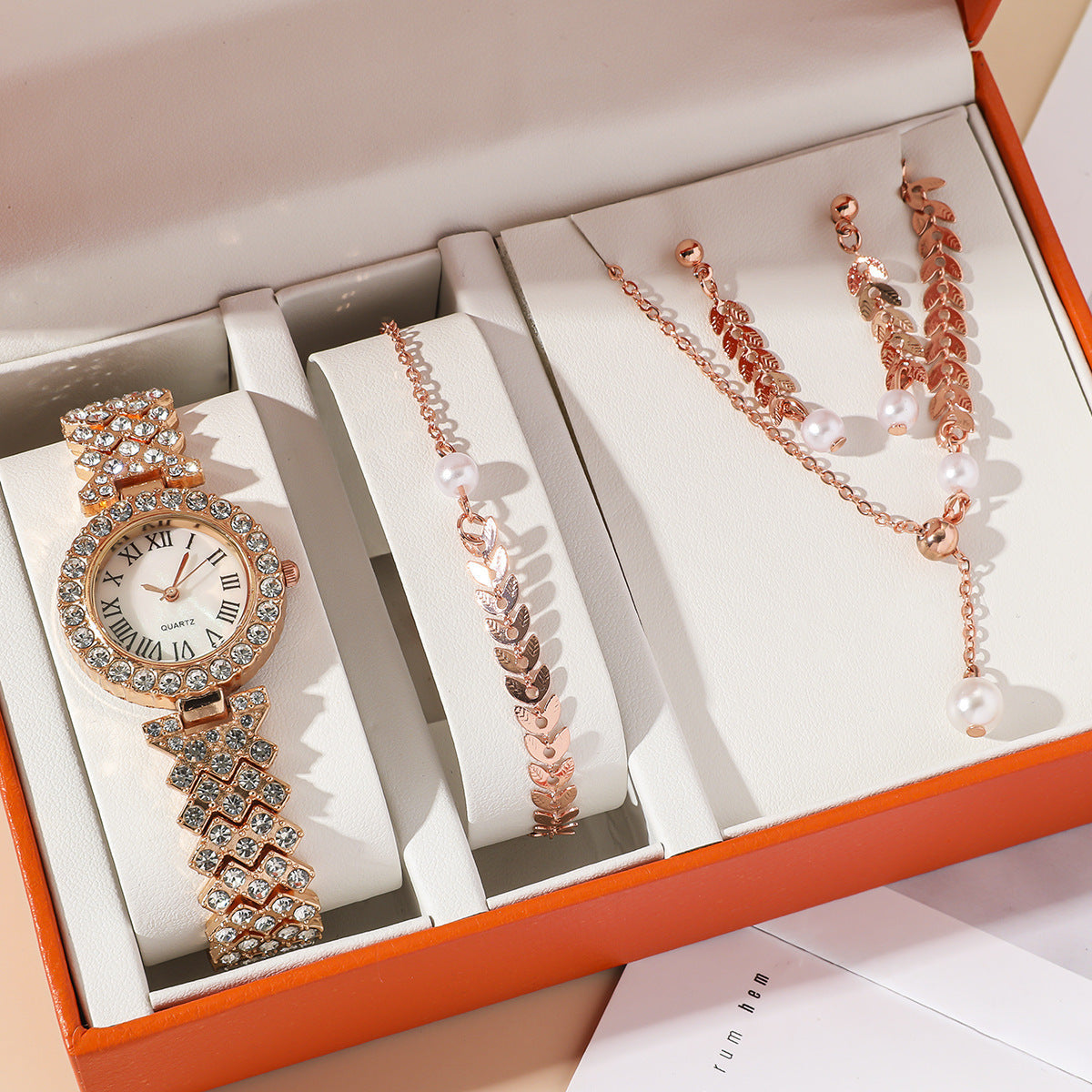 Diamond women watches with rhinestones, bracelet, necklace, and earrings in a luxury gift box. Fashionable quartz design.