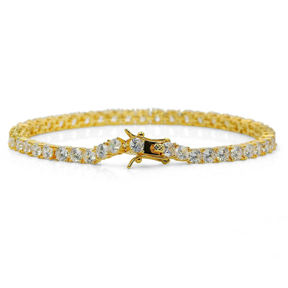 Brass tennis bracelet with AAA CZ stones in gold finish.