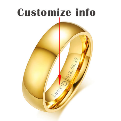 Golden stainless steel couple ring with personalized engraving detail, showcasing luxury and durability.