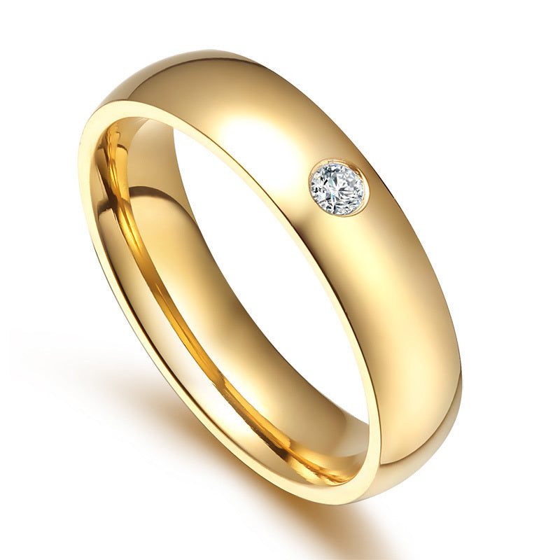 Golden stainless steel couple ring with diamond accent for matching jewelry set.