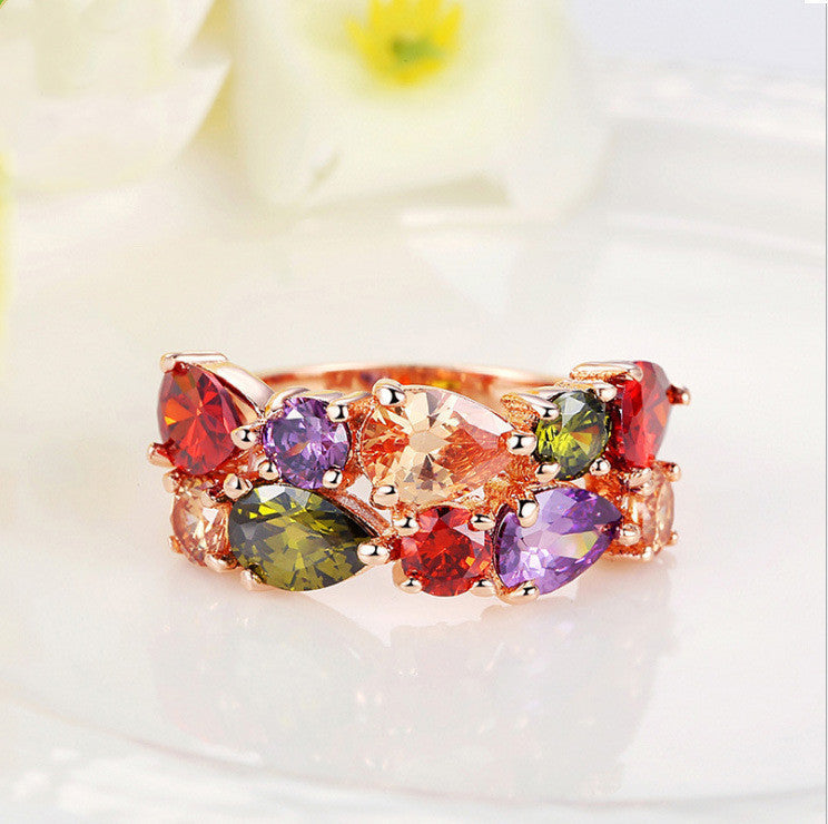 Colorful zircon ring with multicolored stones on gold-plated band.