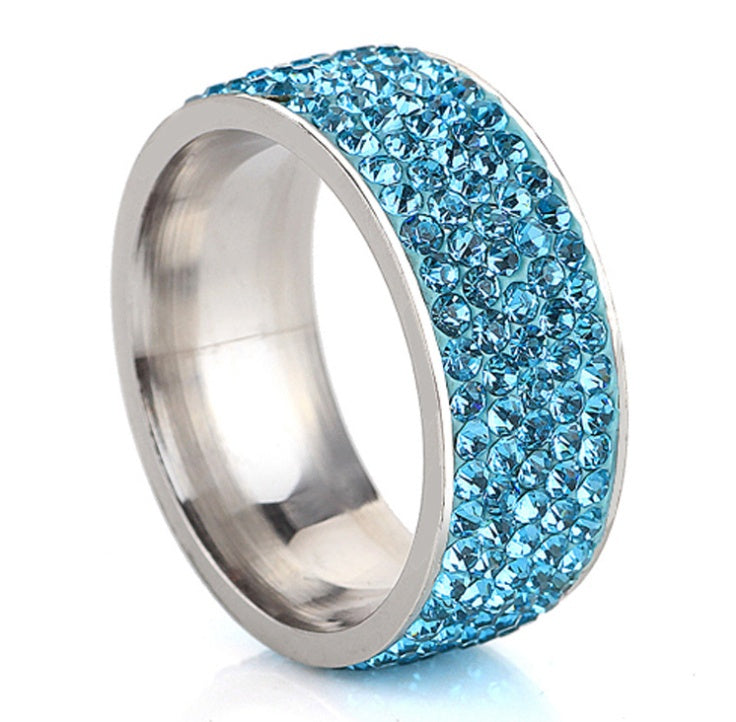 Stainless steel ring with five rows of blue gemstones.