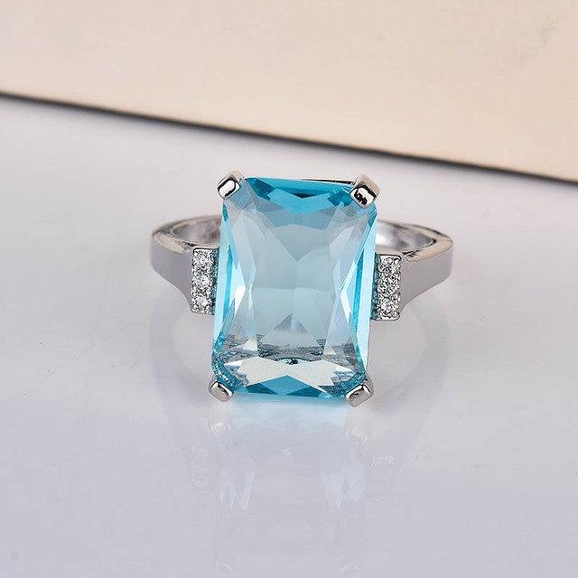 Elegant Kuololit Paraiba gemstone ring for women, featuring a vibrant blue gemstone.