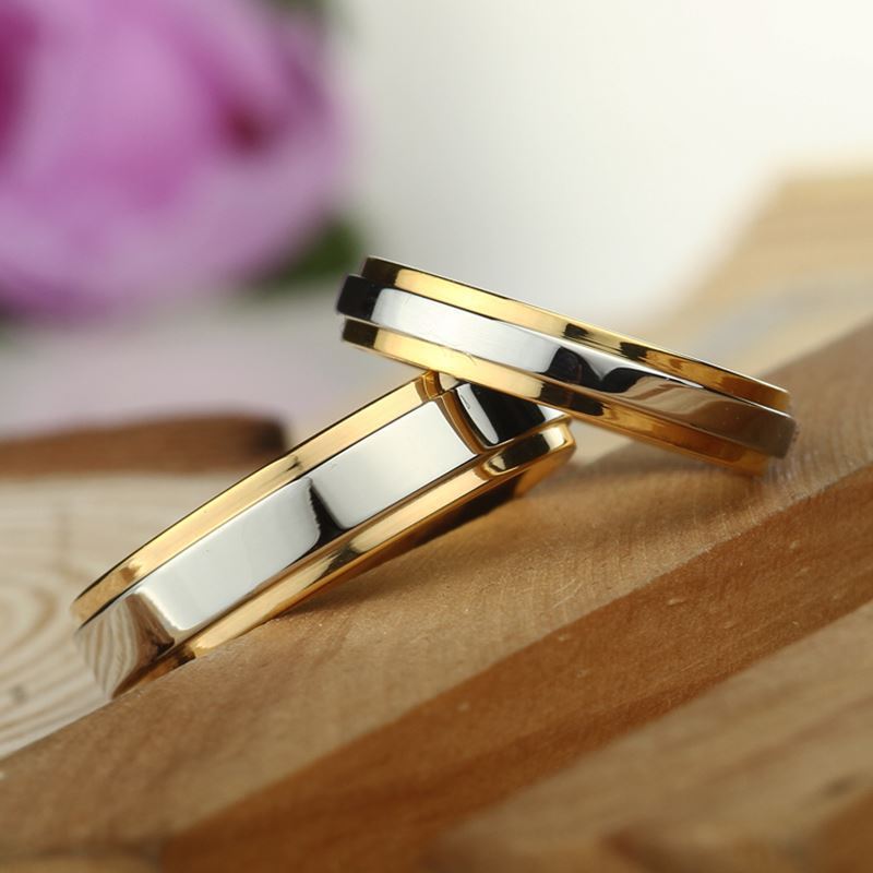 Gold alloy couple rings with geometric design, available in sizes 6-13.