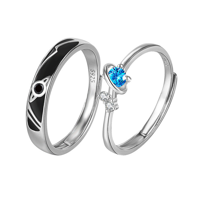 Dream Planet Couple Rings in sterling silver with geometric design and blue gemstone.