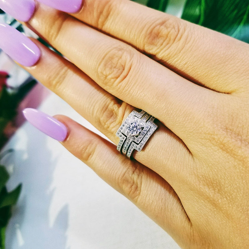 Close-up of hand wearing a nickel-free, electroplated true platinum ring with intricate design, 10mm width.