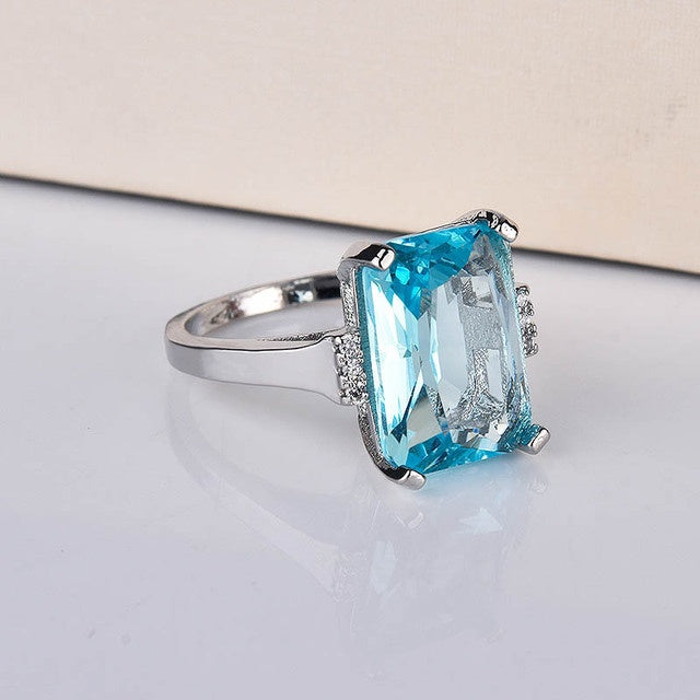 Kuololit Paraiba gemstone ring for women with vibrant blue stone.