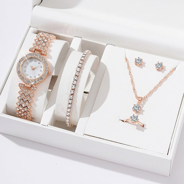 Diamond women watch set with rhinestone bracelet, necklace, and earrings in rose gold.