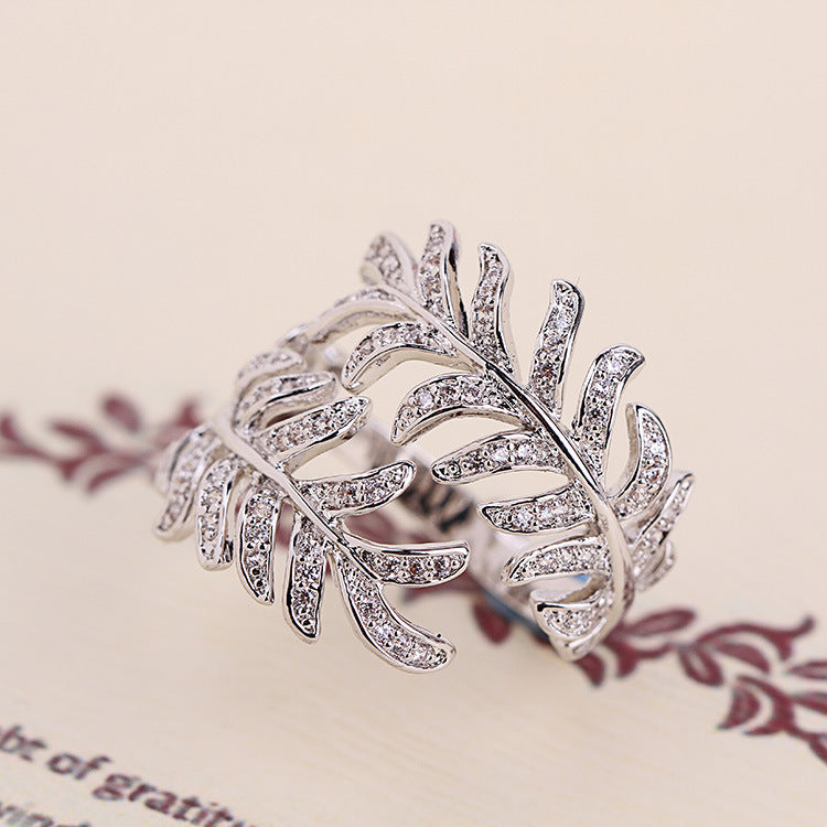 Mimosa leaves rings crafted from alloy, featuring intricate leaf details, adjustable size.