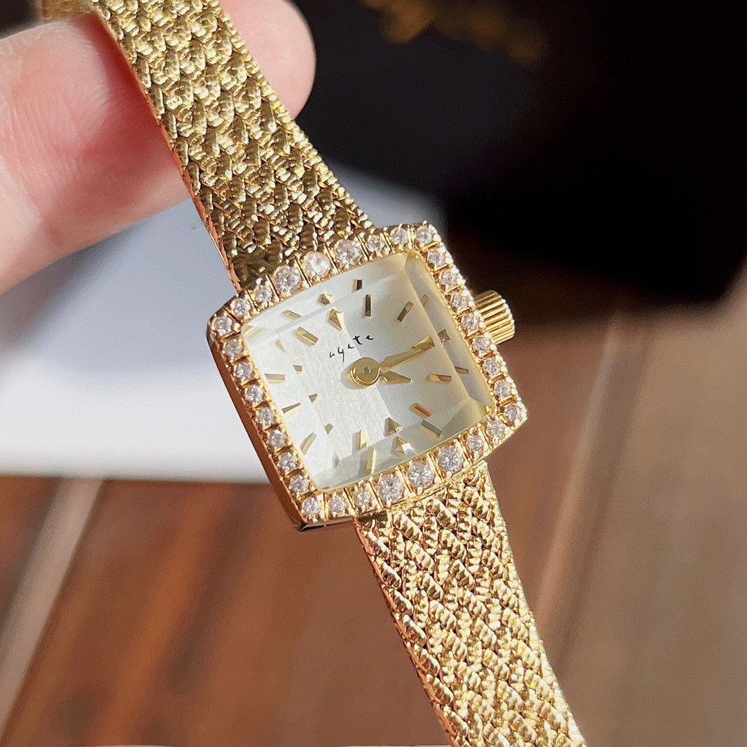 Zhonggu Small Golden Watch with square full gold mesh belt and spiral crown.