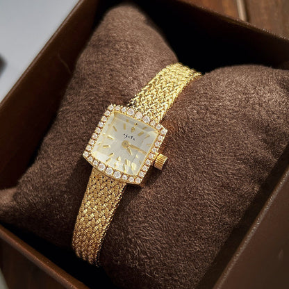 Zhonggu Small Golden Watch with square face and full gold mesh belt.