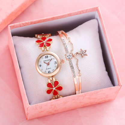 Ladies petal patterned quartz watch bracelet set in pink box.