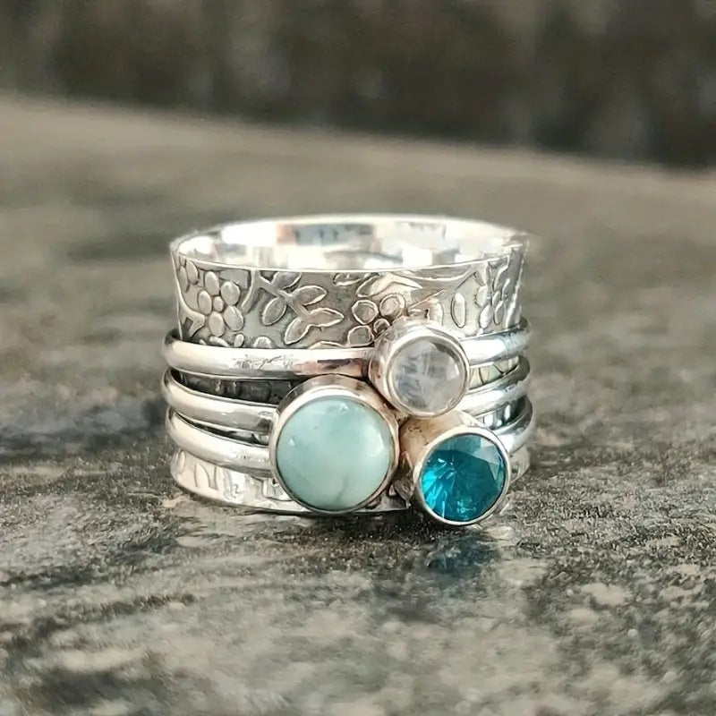 Stone ring set with colorful stones in antique silver alloy, geometric design.