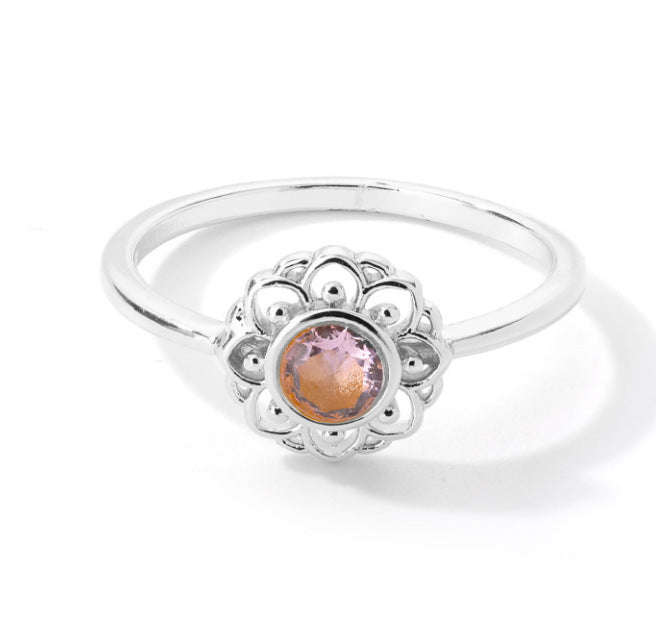 Stainless steel lotus ring with opal center, vintage moon and sun design.