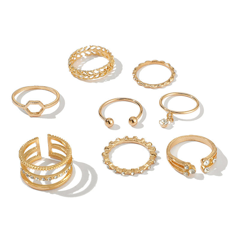 Elegant Diamond Set of 8 Rings with Geometric Designs in Gold Alloy.