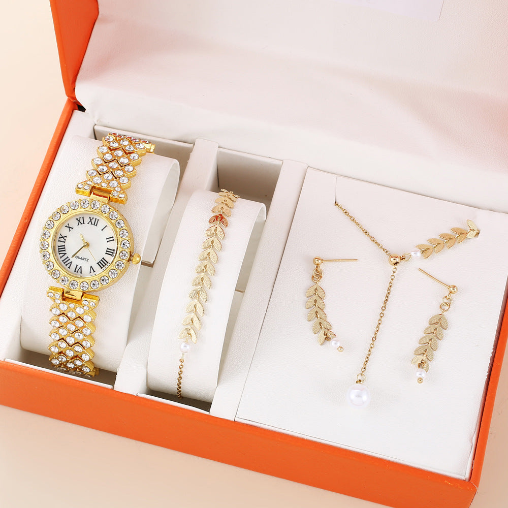 Luxury diamond women watch set with rhinestones, including bracelet, necklace, and earrings in a stylish box.