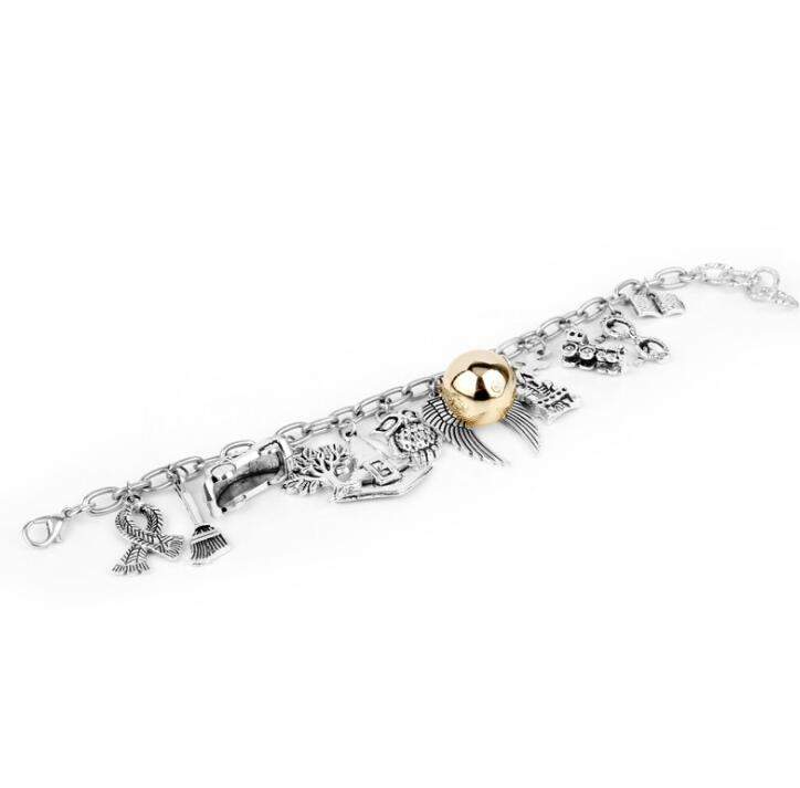 Angel wings bracelet in gold silver alloy with charms. angel wing bracelet