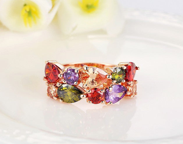 Colorful zircon ring with multiple gemstones on 18k gold-plated copper band.