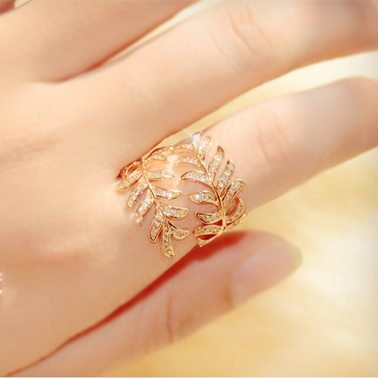 Mimosa leaves ring with intricate leaf design, adjustable alloy material.