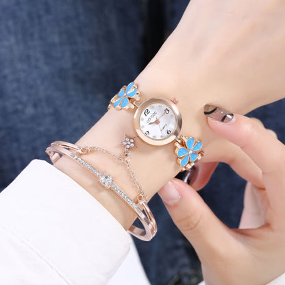 Ladies Petal Patterned Quartz Watch Bracelet Set with blue floral design on wrist.