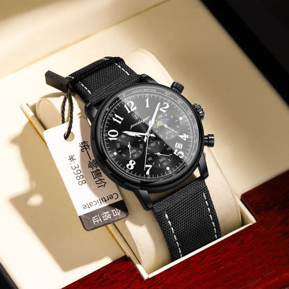 Fashion quartz watch with black surface and black belt, displayed in packaging.