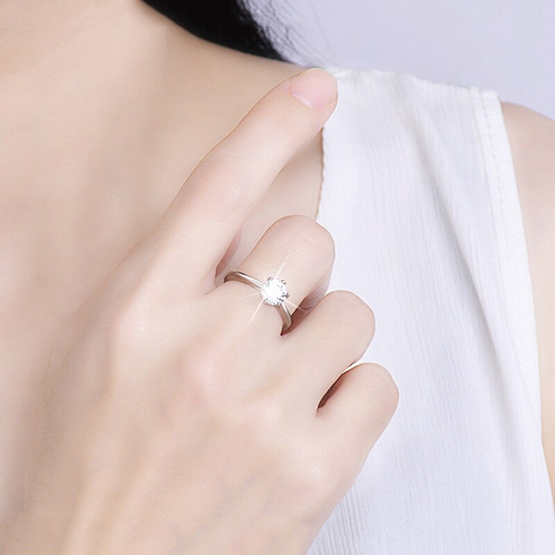 S925 silver ring with zircon stone on finger.