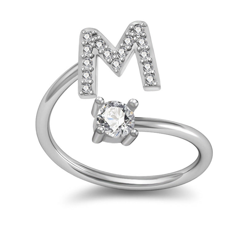 Stylish alphabet ring with letter M, sterling silver inlaid with gems, adjustable opening.