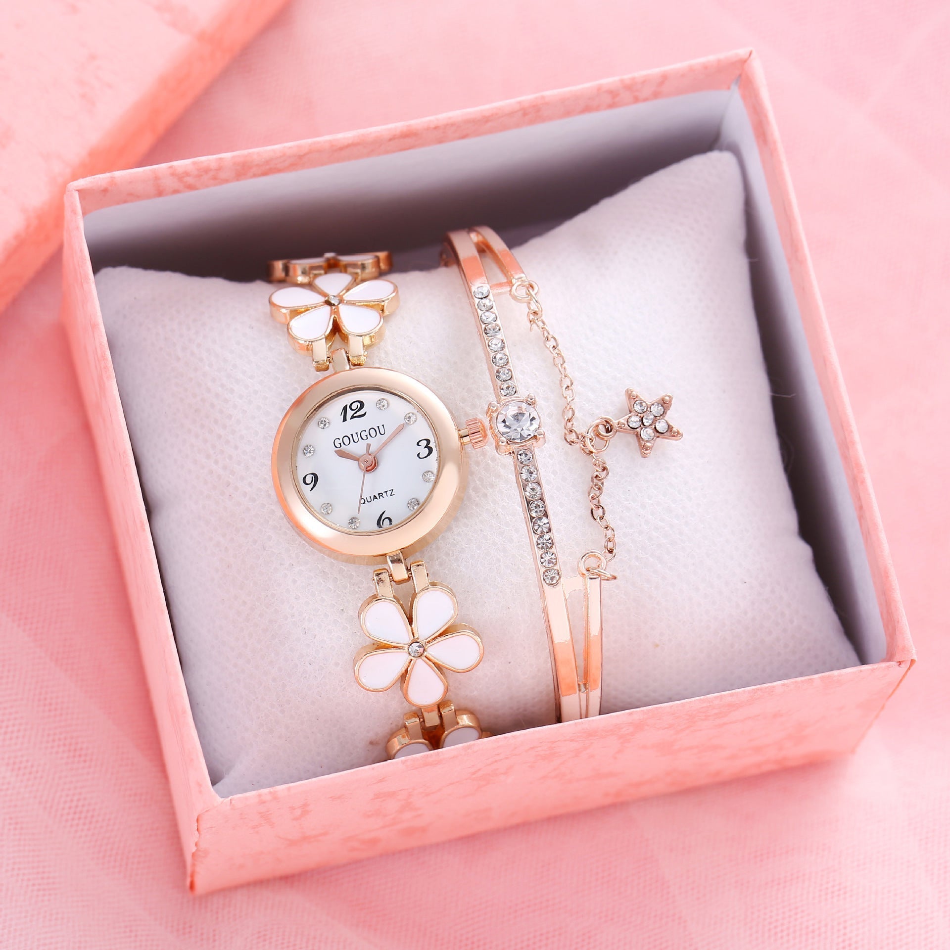 Ladies petal patterned quartz watch bracelet set in a pink gift box.