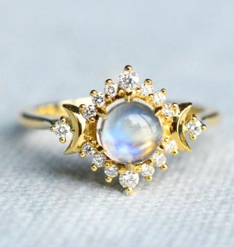 Fashion ring with moonstone center and intricate gold detailing. Fashion ring with moonstone and gold detailing