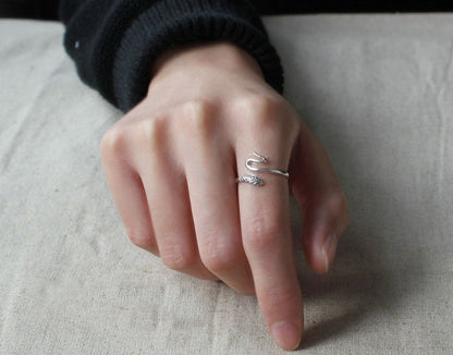 925 sterling silver small snake ring with unique design on hand.