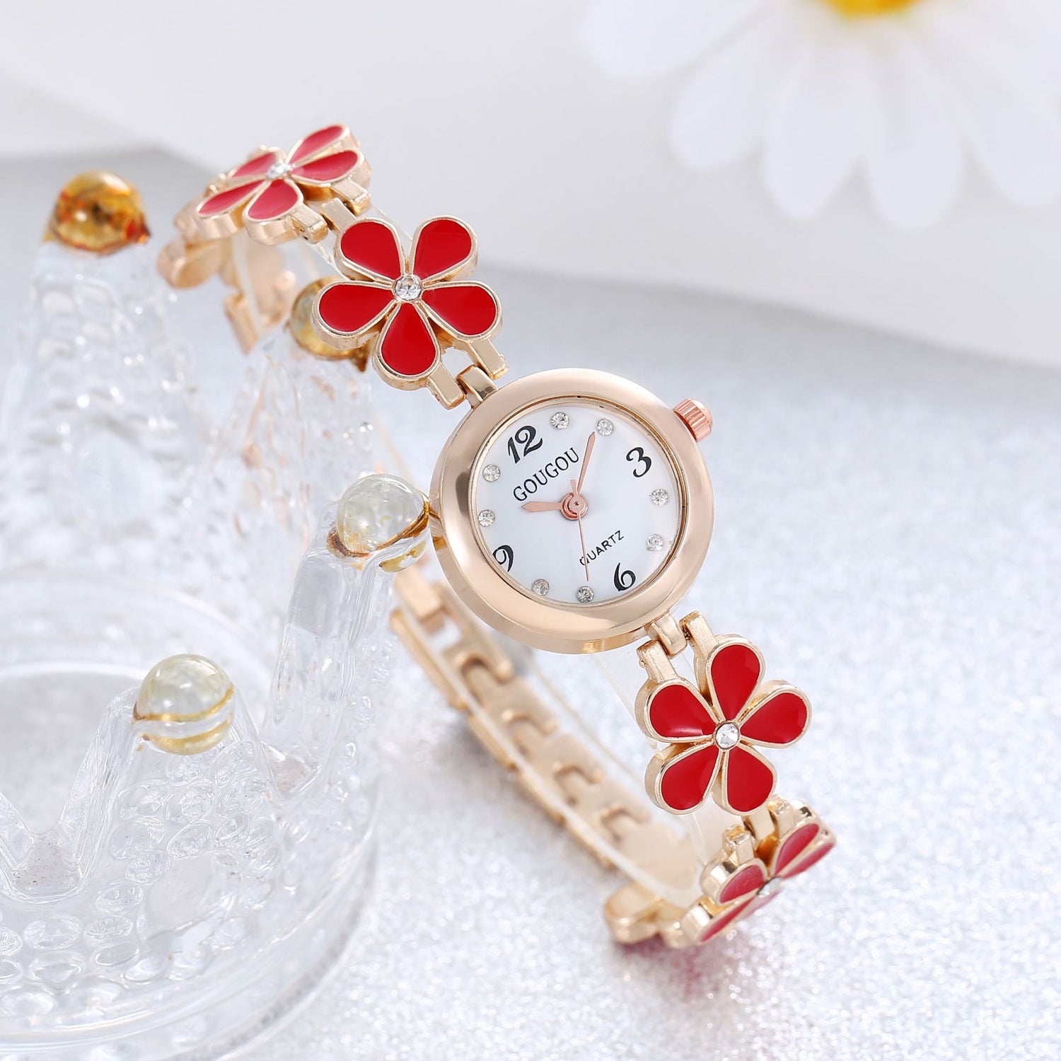 Ladies petal patterned quartz watch bracelet set with red flower design and circular dial.