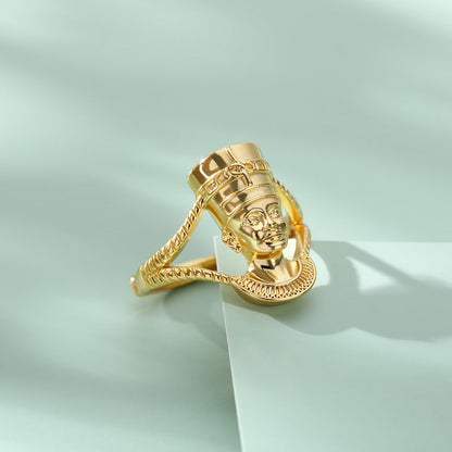 Indian Double Layered Couple Ring in gold with intricate design on light green background.