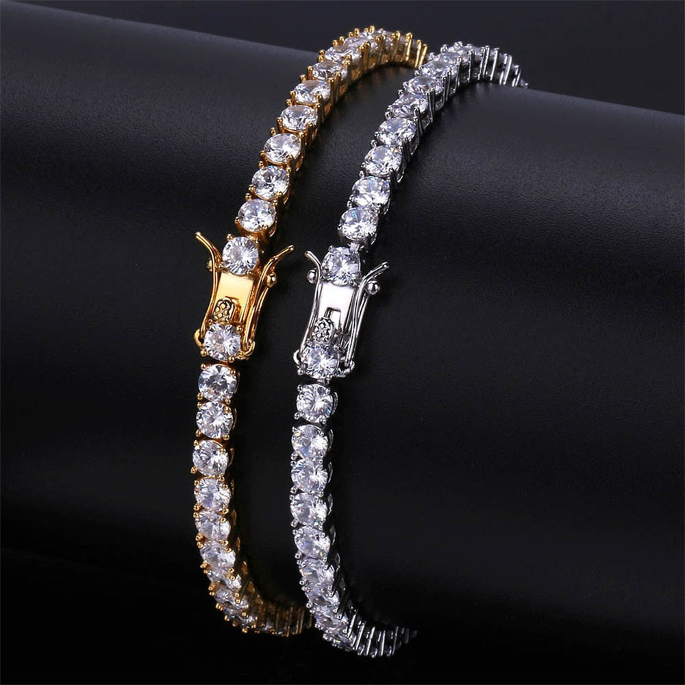 Gold and silver brass tennis bracelets with AAA CZ stones in 3mm to 5mm sizes.