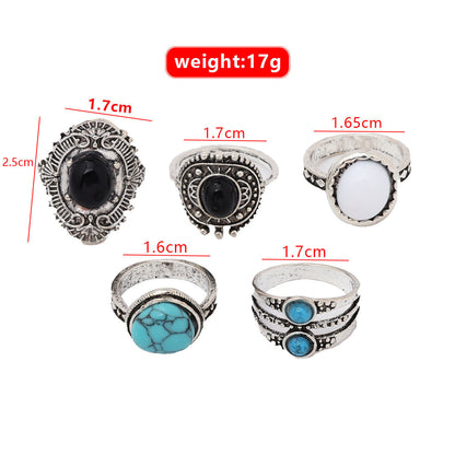 5-piece geometric alloy joint ring set with unique designs.