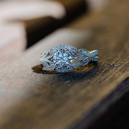 Elegant European American princess diamond ring with tree leaf design on wooden surface.