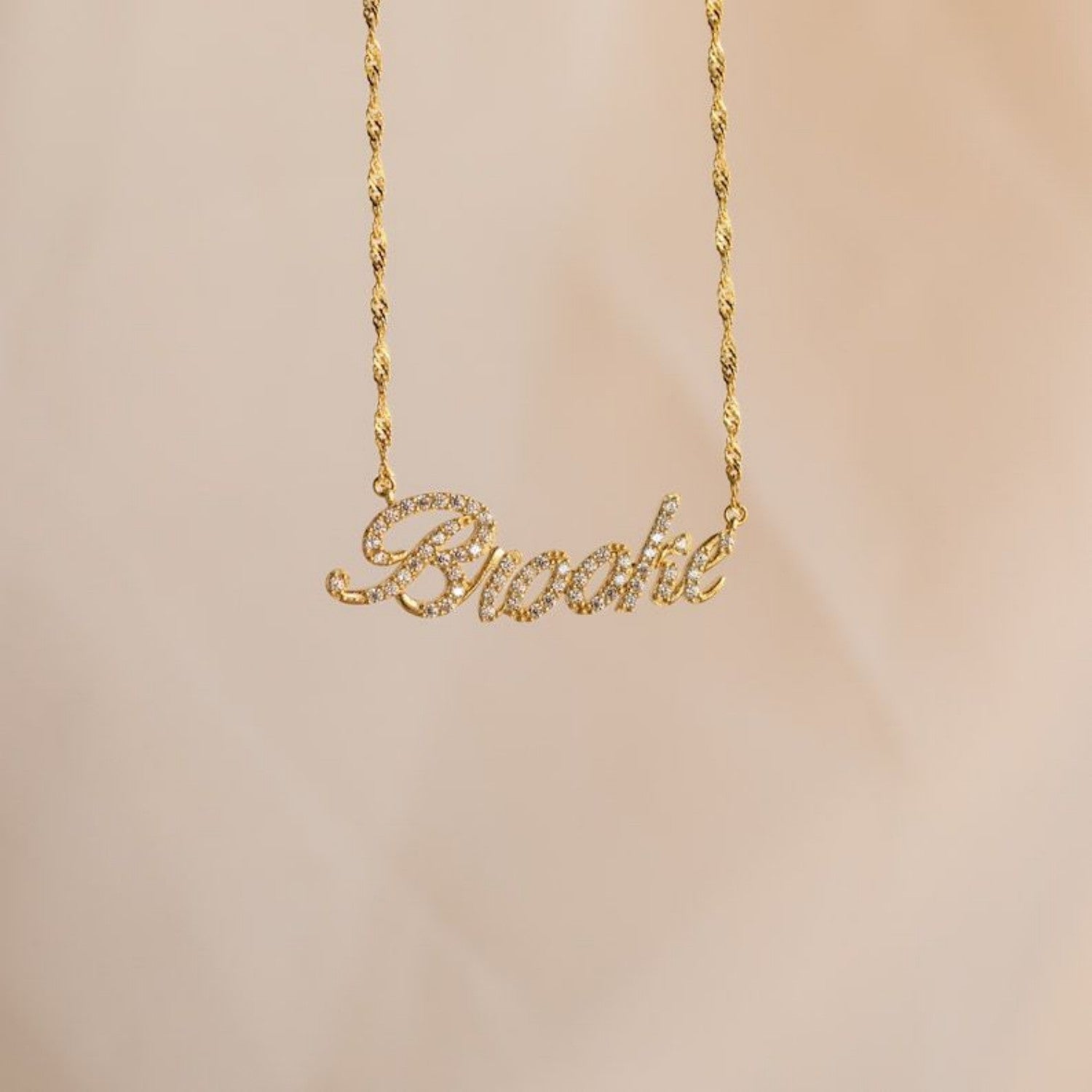 Elegant gold twisted chain necklace with customized name inlaid with zircon.