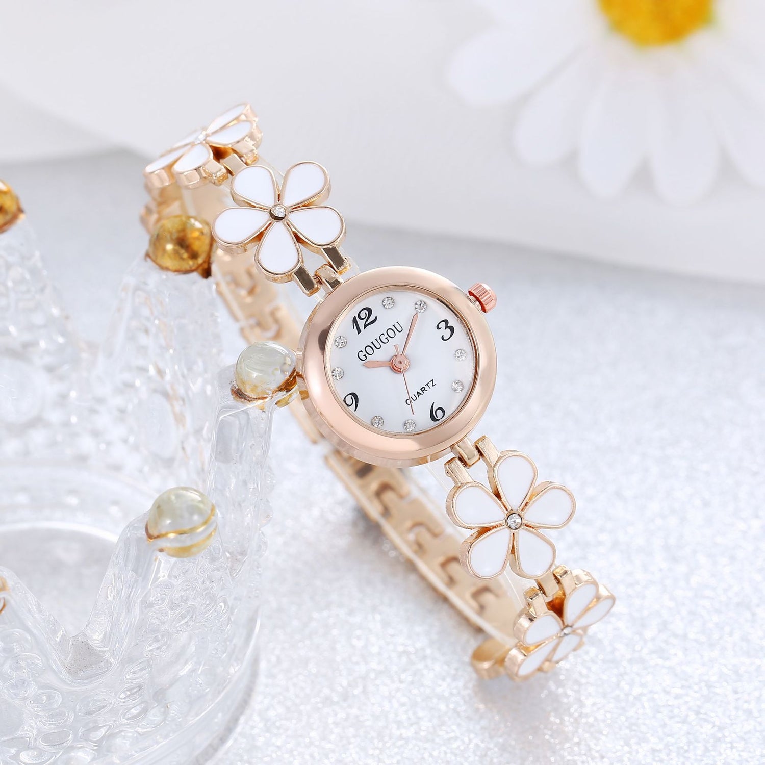 Ladies petal patterned quartz watch bracelet set with floral design and alloy strap.