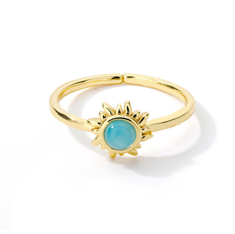 Stainless steel ring with vintage golden lotus design and opal sun motif.