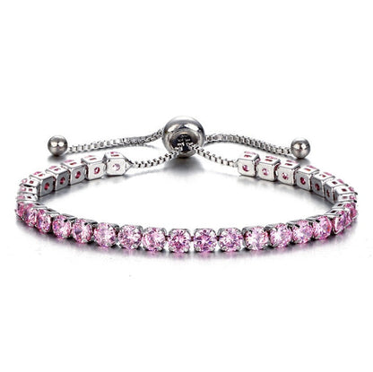 Cubic zirconia tennis bracelet with pink stones and adjustable clasp.