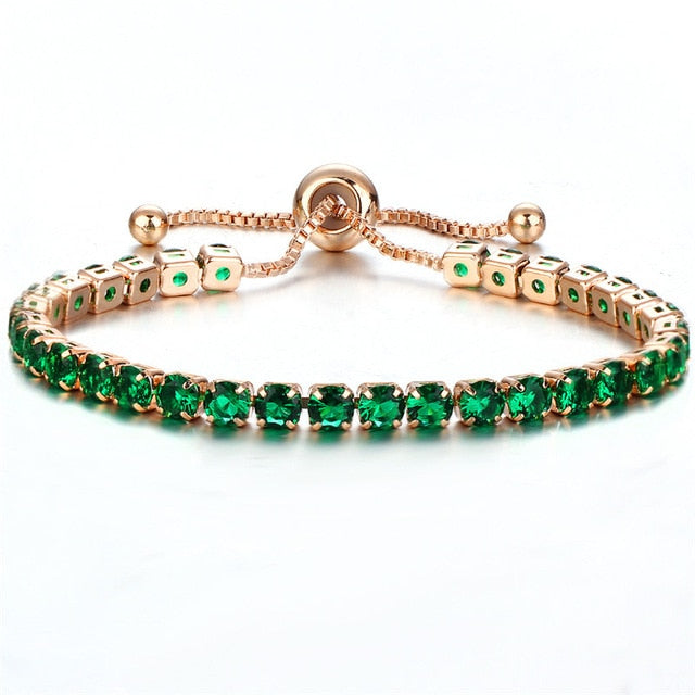 Elegant cubic zirconia tennis bracelet and bangle with green stones.