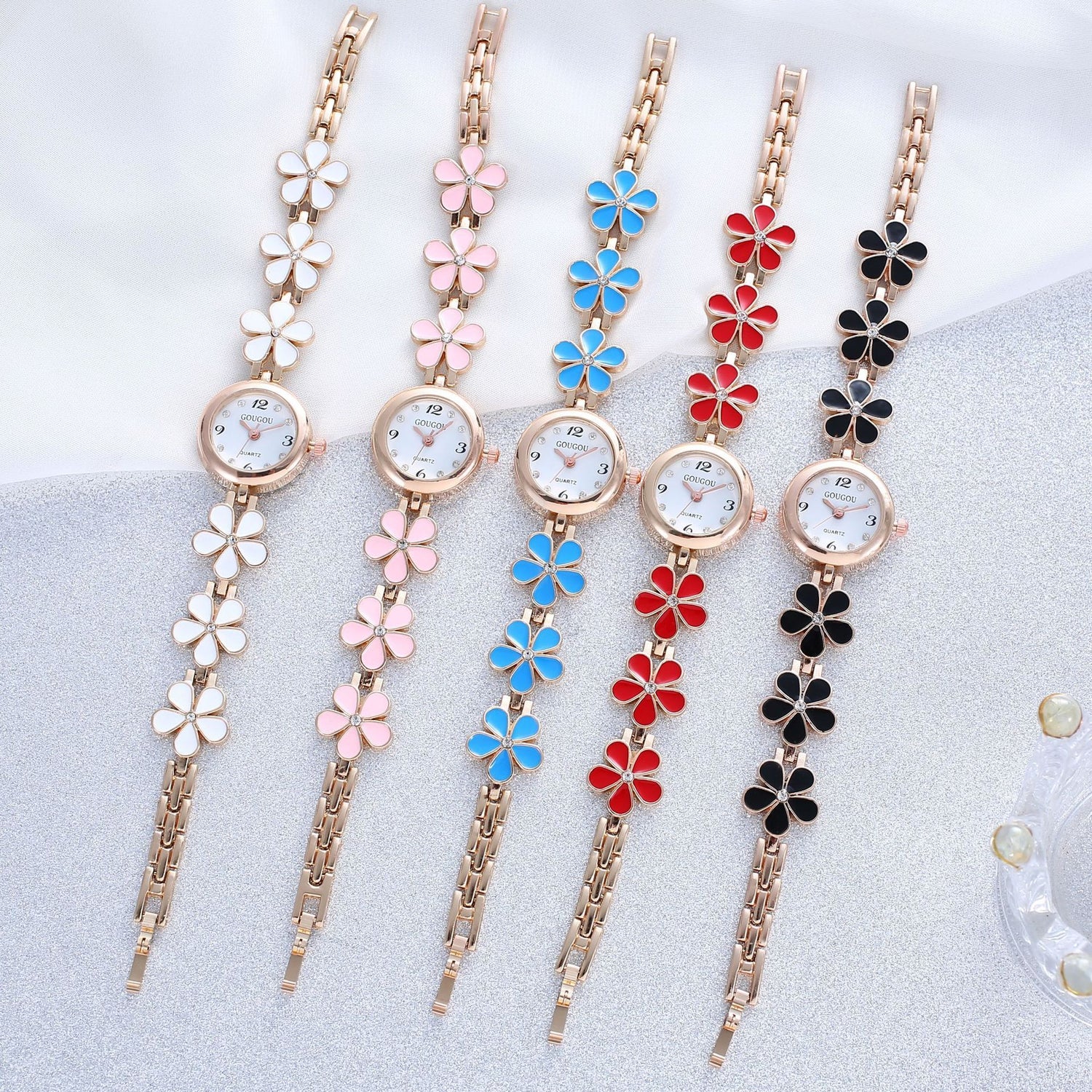 Ladies petal patterned quartz watch bracelet set in white, pink, blue, red, and black colors.