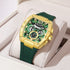 Megia luminous watch with gold case and green silicone band in display box.