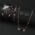 HeartQuartz 4pk womens watch set with black watch, heart-shaped earrings, necklace, and bracelet.