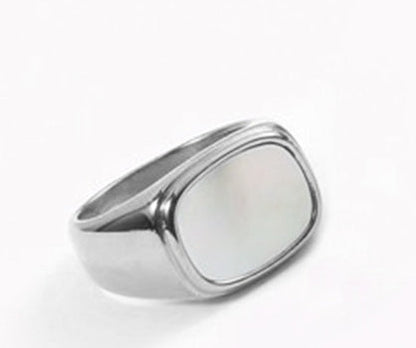 Fashion ring with sleek silver band and rectangular face.