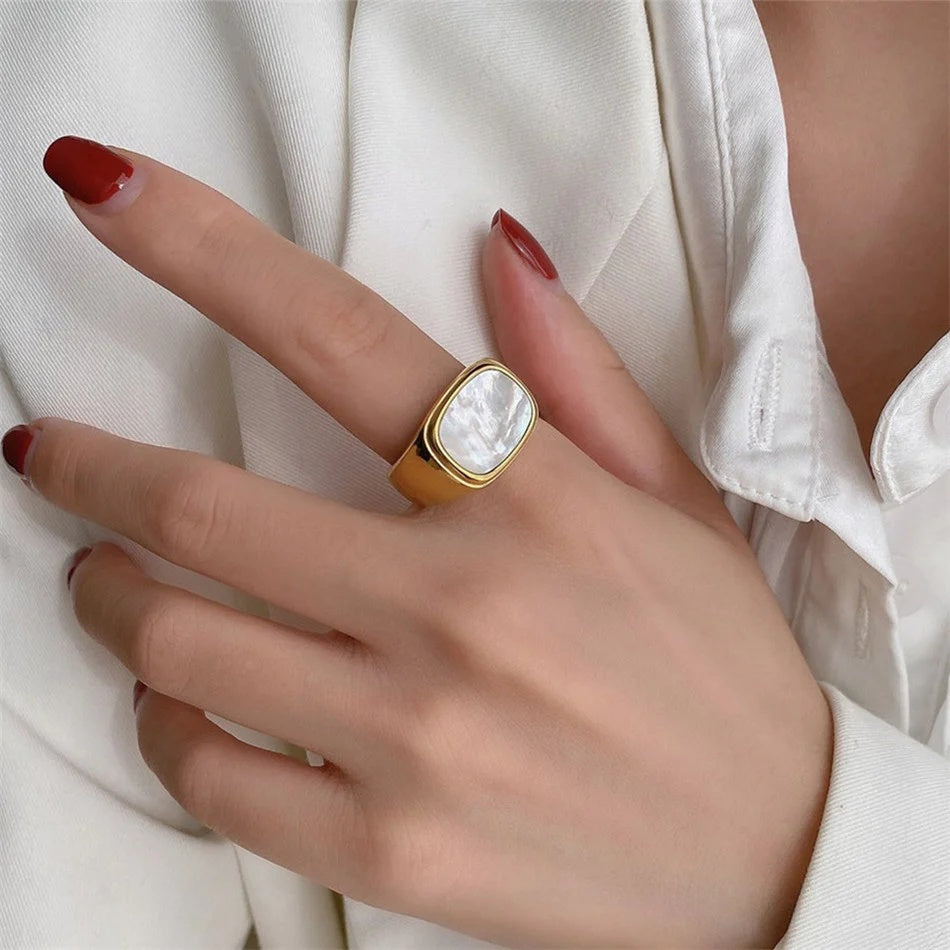 Fashion ring with a sleek silver band and rectangular face